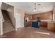 Modern kitchen with wooden cabinets and island at 821 E Bradstock Way, San Tan Valley, AZ 85140