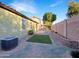 Landscaped backyard with gravel, grass, and block wall at 8937 E Crescent Ave, Mesa, AZ 85208