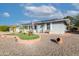 Gray single story home with solar panels, palm trees, and a landscaped yard at 10754 W Brookside Dr, Sun City, AZ 85351