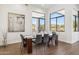Modern dining area with wood table and gray chairs at 10835 N Cherry Hills Ct, Fountain Hills, AZ 85268