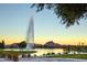 Tall fountain in a park setting at sunset near lake and mountains at 10835 N Cherry Hills Ct, Fountain Hills, AZ 85268