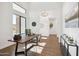 Sunlit home office with a large desk and wood flooring at 10835 N Cherry Hills Ct, Fountain Hills, AZ 85268