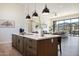 Modern kitchen island with wood cabinetry and quartz countertops at 10835 N Cherry Hills Ct, Fountain Hills, AZ 85268