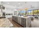 Modern kitchen with large island, stainless steel appliances, and white cabinetry at 10835 N Cherry Hills Ct, Fountain Hills, AZ 85268