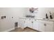 Laundry room with white cabinets and quartz countertops at 10835 N Cherry Hills Ct, Fountain Hills, AZ 85268