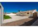 Backyard with covered patio, artificial turf, and brick pavers at 13050 N 17Th Ave, Phoenix, AZ 85029