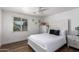 Bedroom with a full-size bed and an adjacent window at 13050 N 17Th Ave, Phoenix, AZ 85029
