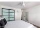 Bedroom with sliding doors and a full-size bed at 13050 N 17Th Ave, Phoenix, AZ 85029