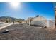 Side view of single story home with gravel landscaping at 13050 N 17Th Ave, Phoenix, AZ 85029