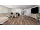 Bright and airy living room with sectional sofa and hardwood floors at 13050 N 17Th Ave, Phoenix, AZ 85029
