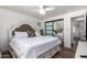 Main bedroom with plush bed and mirrored closet doors at 13050 N 17Th Ave, Phoenix, AZ 85029