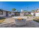 Stunning backyard oasis with a pool and fire pit at 1345 W Edgemont Ave, Phoenix, AZ 85007