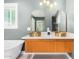 Elegant bathroom boasts a double vanity with gold fixtures and marble countertops at 1345 W Edgemont Ave, Phoenix, AZ 85007