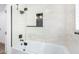 Updated bathroom with a bathtub and glass shower enclosure at 1345 W Edgemont Ave, Phoenix, AZ 85007