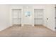 Spacious bedroom with built-in closets and a window at 1345 W Edgemont Ave, Phoenix, AZ 85007