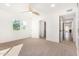 Spacious bedroom with ceiling fan, large windows, and access to closets at 1345 W Edgemont Ave, Phoenix, AZ 85007