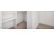Bright walk-in closet with shelving and hanging rod at 1345 W Edgemont Ave, Phoenix, AZ 85007