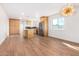 Bright dining area with wood floors and modern chandelier at 1345 W Edgemont Ave, Phoenix, AZ 85007
