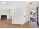Bright entryway with fireplace and stylish wallpaper at 1345 W Edgemont Ave, Phoenix, AZ 85007
