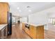 Modern kitchen with island, built-in microwave and hardwood floors at 1345 W Edgemont Ave, Phoenix, AZ 85007