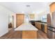 Updated kitchen with island and stainless steel appliances at 1345 W Edgemont Ave, Phoenix, AZ 85007