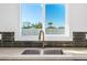 Modern kitchen sink and faucet with stylish backsplash at 1345 W Edgemont Ave, Phoenix, AZ 85007