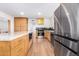 Modern kitchen with stainless steel appliances and light wood cabinets at 1345 W Edgemont Ave, Phoenix, AZ 85007