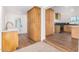 Modern kitchen with light wood cabinets, a gas range, and stylish backsplash at 1345 W Edgemont Ave, Phoenix, AZ 85007