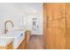 Well-appointed laundry room with a large farmhouse sink and built-in storage at 1345 W Edgemont Ave, Phoenix, AZ 85007