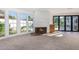 Living room with fireplace, pool view, and sliding doors at 1345 W Edgemont Ave, Phoenix, AZ 85007