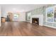 Open living room with hardwood floors and fireplace at 1345 W Edgemont Ave, Phoenix, AZ 85007