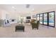Living room with fireplace, pool view and seating area at 1345 W Edgemont Ave, Phoenix, AZ 85007