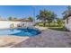 Inviting backyard oasis featuring a large pool and fire pit at 1345 W Edgemont Ave, Phoenix, AZ 85007
