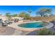 Relaxing kidney-shaped pool with ample patio space at 1417 S 115Th Dr, Avondale, AZ 85323