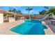 Relaxing pool area, complete with a slide and patio furniture at 15201 N 45Th Pl, Phoenix, AZ 85032