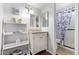 Bright bathroom boasts a vanity with storage and shower at 15409 N 61St Ave, Glendale, AZ 85306