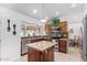 Spacious kitchen featuring an island, stainless steel appliances, and ample cabinetry at 15409 N 61St Ave, Glendale, AZ 85306