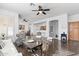 Living room with hardwood floors, fireplace, and adjacent dining area at 16600 N Thompson Peak Pkwy # 2036, Scottsdale, AZ 85260