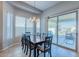 Bright dining area with sliding glass doors to the backyard at 16762 W Sheridan St, Goodyear, AZ 85395