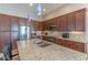 Modern kitchen with stainless steel appliances and granite countertops at 16762 W Sheridan St, Goodyear, AZ 85395