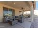 Relaxing covered patio with seating and a fire pit at 16762 W Sheridan St, Goodyear, AZ 85395