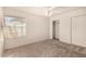 Bedroom with window, ceiling fan and closet at 1716 N Temple St, Mesa, AZ 85203