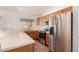 Kitchen with stainless steel appliances and wood cabinets at 1716 N Temple St, Mesa, AZ 85203