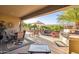 Outdoor patio with seating area, built-in grill, and a water feature at 19330 N Hunters Run, Surprise, AZ 85387