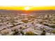 Aerial view of neighborhood with mountain views at sunset at 21057 N 74Th Way, Scottsdale, AZ 85255