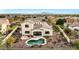 Aerial view of a house with pool and landscaped backyard in a community at 3414 N Park St, Buckeye, AZ 85396