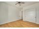 Spacious bedroom with wood floors and sliding doors to closet at 36469 N 32Nd Ave, Phoenix, AZ 85086