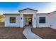 Front entrance of a modern home with a covered porch at 36469 N 32Nd Ave, Phoenix, AZ 85086