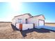 House exterior with tan walls and brown tile roof at 37259 W Illini St, Tonopah, AZ 85354