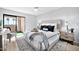 Bright bedroom with a queen-size bed and private balcony access at 4141 N 31St St # 414, Phoenix, AZ 85016